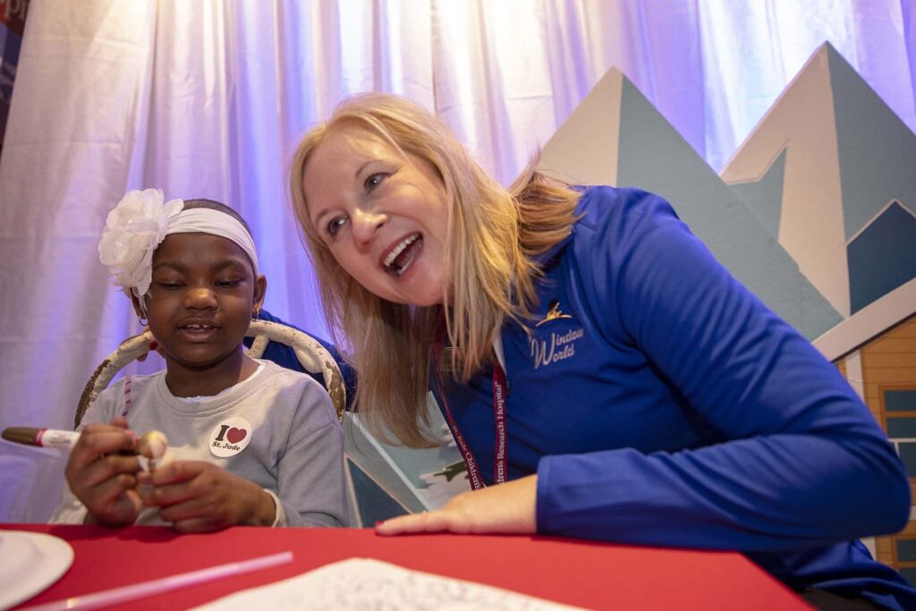 Window World employee and child at St. Jude charity event