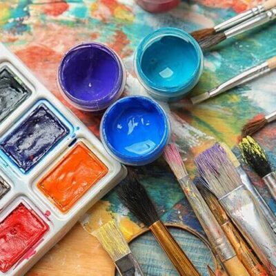 paints and paint brushes with paint on them