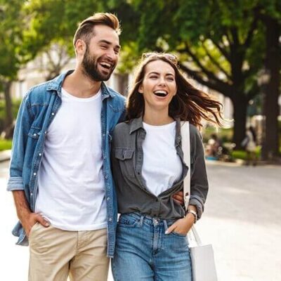 couple smiling on a walk